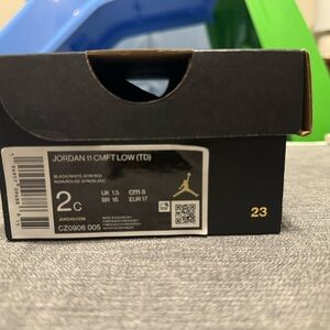 Jordan 11 CMFT Low (TD) Black and Red Sneakers